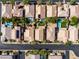 Aerial view of a neighborhood with a street and a series of homes, pools, and trees at 7854 Brianna Cheerful Ave, Las Vegas, NV 89178