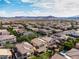 Community aerial view showcasing a community pool and the landscape of homes at 7854 Brianna Cheerful Ave, Las Vegas, NV 89178