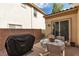 Private back patio features a grill, dining table, and opens to the main house at 7854 Brianna Cheerful Ave, Las Vegas, NV 89178
