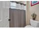 Bathroom featuring walk-in shower and toilet at 7854 Brianna Cheerful Ave, Las Vegas, NV 89178