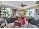 Plant-filled room with a red sitting chair at 7854 Brianna Cheerful Ave, Las Vegas, NV 89178