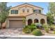 Charming two-story home with a covered front porch and a well-manicured lawn at 7854 Brianna Cheerful Ave, Las Vegas, NV 89178