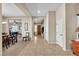 An expansive foyer with tile flooring, white walls, and natural light creates an inviting entrance at 7854 Brianna Cheerful Ave, Las Vegas, NV 89178