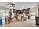 Stylish kitchen with stainless steel appliances, dark wood cabinets, and a bright breakfast nook at 7854 Brianna Cheerful Ave, Las Vegas, NV 89178