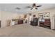 An open living room offers ample space with a ceiling fan and a variety of furniture arrangements at 7854 Brianna Cheerful Ave, Las Vegas, NV 89178