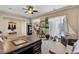 Open-concept room with office area, tile floors, neutral colors, and natural light at 7854 Brianna Cheerful Ave, Las Vegas, NV 89178
