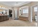 Bright main bathroom features a soaking tub, tile flooring, shower, and a water closet at 7854 Brianna Cheerful Ave, Las Vegas, NV 89178