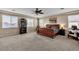 Spacious carpeted primary bedroom featuring neutral paint and ceiling fan at 7854 Brianna Cheerful Ave, Las Vegas, NV 89178