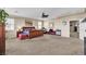 Spacious main bedroom features neutral colors, carpet flooring, ceiling fan, and a large bed at 7854 Brianna Cheerful Ave, Las Vegas, NV 89178