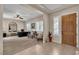 Office with a wood door, tile flooring, shutters, and neutral-toned walls at 7854 Brianna Cheerful Ave, Las Vegas, NV 89178