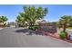 Parkside Estates entrance with stone signage, mature landscaping, and a secure gated entry at 8221 Ebony Peak St, Las Vegas, NV 89143