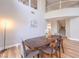 Spacious dining room with a wooden table, staircase, and plenty of natural light at 8221 Ebony Peak St, Las Vegas, NV 89143