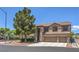 Elegant home featuring a three-car garage, desert landscaping, and lush, mature shade trees at 8221 Ebony Peak St, Las Vegas, NV 89143