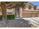 Charming home featuring a three-car garage, desert landscaping, and a welcoming front door at 8221 Ebony Peak St, Las Vegas, NV 89143