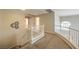 Upstairs hallway with carpeted flooring, white banisters, and transom window at 8221 Ebony Peak St, Las Vegas, NV 89143