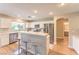 An open-concept kitchen boasts stainless steel appliances and a breakfast bar with stylish seating at 8221 Ebony Peak St, Las Vegas, NV 89143