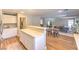 The kitchen features a breakfast bar with seating and white cabinets and leads to the living area at 8221 Ebony Peak St, Las Vegas, NV 89143