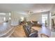 Spacious living room boasts hardwood floors, a fireplace, and comfortable seating at 8221 Ebony Peak St, Las Vegas, NV 89143
