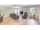 Cozy living room with a fireplace, comfortable seating, and a ceiling fan at 8221 Ebony Peak St, Las Vegas, NV 89143