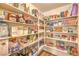Organized pantry with ample shelving provides plenty of storage space for food and household goods at 8221 Ebony Peak St, Las Vegas, NV 89143