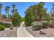 Attractive community walking path with mature landscaping and trees at 8221 Ebony Peak St, Las Vegas, NV 89143
