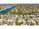 Community aerial view showcasing the neighborhood's lush landscaping, lake, and residential homes at 8324 Tide Pool Dr, Las Vegas, NV 89128