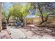 Entertainer's backyard offers a barbecue, patio seating, and hot tub for outdoor enjoyment at 8324 Tide Pool Dr, Las Vegas, NV 89128