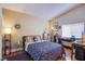 Comfortable bedroom with hardwood floors, warm colors, and bright lamp at 8324 Tide Pool Dr, Las Vegas, NV 89128