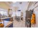 Eat-in kitchen with tile floors, bright light, and stainless steel refrigerator at 8324 Tide Pool Dr, Las Vegas, NV 89128
