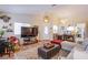 Inviting living room with natural light, hardwood floors, and comfortable furnishings at 8324 Tide Pool Dr, Las Vegas, NV 89128