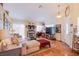Comfortable living room with hardwood floors, cozy fireplace, and neutral color palette at 8324 Tide Pool Dr, Las Vegas, NV 89128