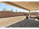 Covered patio offering an outdoor seating area in the large, ready-to-landscape backyard at 8575 Nicholas James Ave, Las Vegas, NV 89143