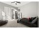 Simple bedroom features a queen bed, a closet with shoe storage, and natural light at 8575 Nicholas James Ave, Las Vegas, NV 89143