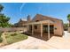 Backyard featuring a covered patio, fire pit, and low-maintenance landscaping at 87 Ginger Lily Ter, Henderson, NV 89074