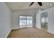 Carpeted bedroom with high ceilings, a ceiling fan, and slider doors leading to a patio at 87 Ginger Lily Ter, Henderson, NV 89074
