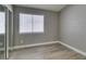 Bedroom offers a serene space with large windows and mirrored closet at 87 Ginger Lily Ter, Henderson, NV 89074
