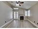 Living room with a fireplace and hardwood flooring at 87 Ginger Lily Ter, Henderson, NV 89074