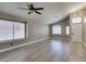 Bright living room featuring vaulted ceiling, multiple windows, and modern flooring at 87 Ginger Lily Ter, Henderson, NV 89074