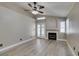 Living room boasts fireplace, hardwood flooring, and bright windows at 87 Ginger Lily Ter, Henderson, NV 89074