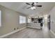 Living room showcases an open-concept layout flowing into the kitchen at 87 Ginger Lily Ter, Henderson, NV 89074