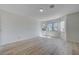 Large, light-filled bedroom boasting wood-look flooring and contemporary architectural design at 8809 Beach Front Dr, Las Vegas, NV 89117