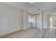Bedroom with neutral walls, light wood flooring, and a closet with sliding doors at 8809 Beach Front Dr, Las Vegas, NV 89117