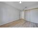 Empty bedroom with neutral walls, light wood flooring, sliding door closet, and recessed lighting at 8809 Beach Front Dr, Las Vegas, NV 89117
