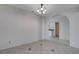 Dining room area featuring tile floors, a decorative light fixture, and an arched doorway at 8809 Beach Front Dr, Las Vegas, NV 89117