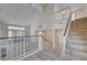 Entryway showcasing the home's open floor plan, staircase, and a modern design aesthetic at 8809 Beach Front Dr, Las Vegas, NV 89117
