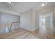 Light-filled upstairs hallway featuring contemporary flooring and an airy, open atmosphere at 8809 Beach Front Dr, Las Vegas, NV 89117