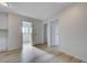 Hallway with wood floors leads to multiple bedrooms and bathrooms at 8809 Beach Front Dr, Las Vegas, NV 89117