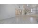 Large open living space with a staircase, tile flooring, and lots of natural light at 8809 Beach Front Dr, Las Vegas, NV 89117