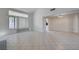 Open concept living room with tile flooring and natural light at 8809 Beach Front Dr, Las Vegas, NV 89117