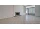 Spacious living room with a fireplace and tile flooring at 8809 Beach Front Dr, Las Vegas, NV 89117
